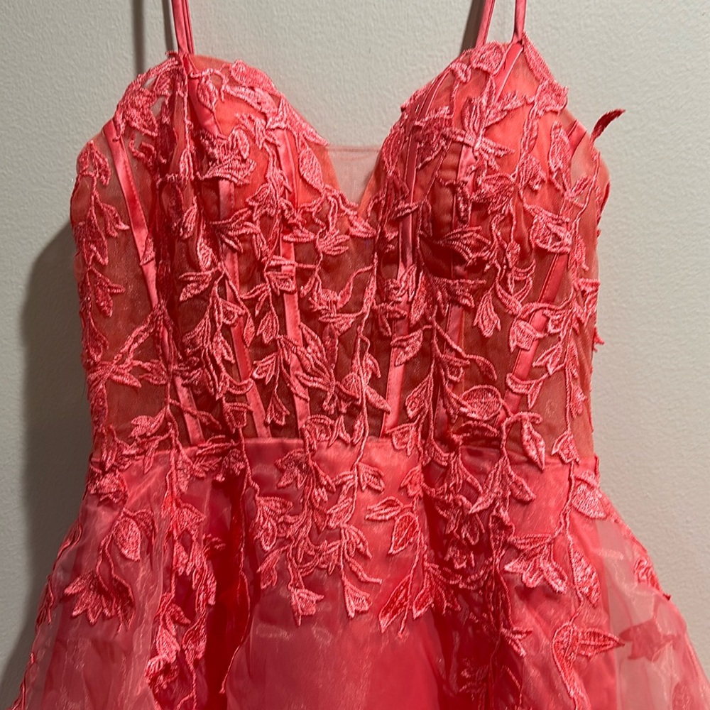 Formal dress. Salmon colored size 2. Never worn.